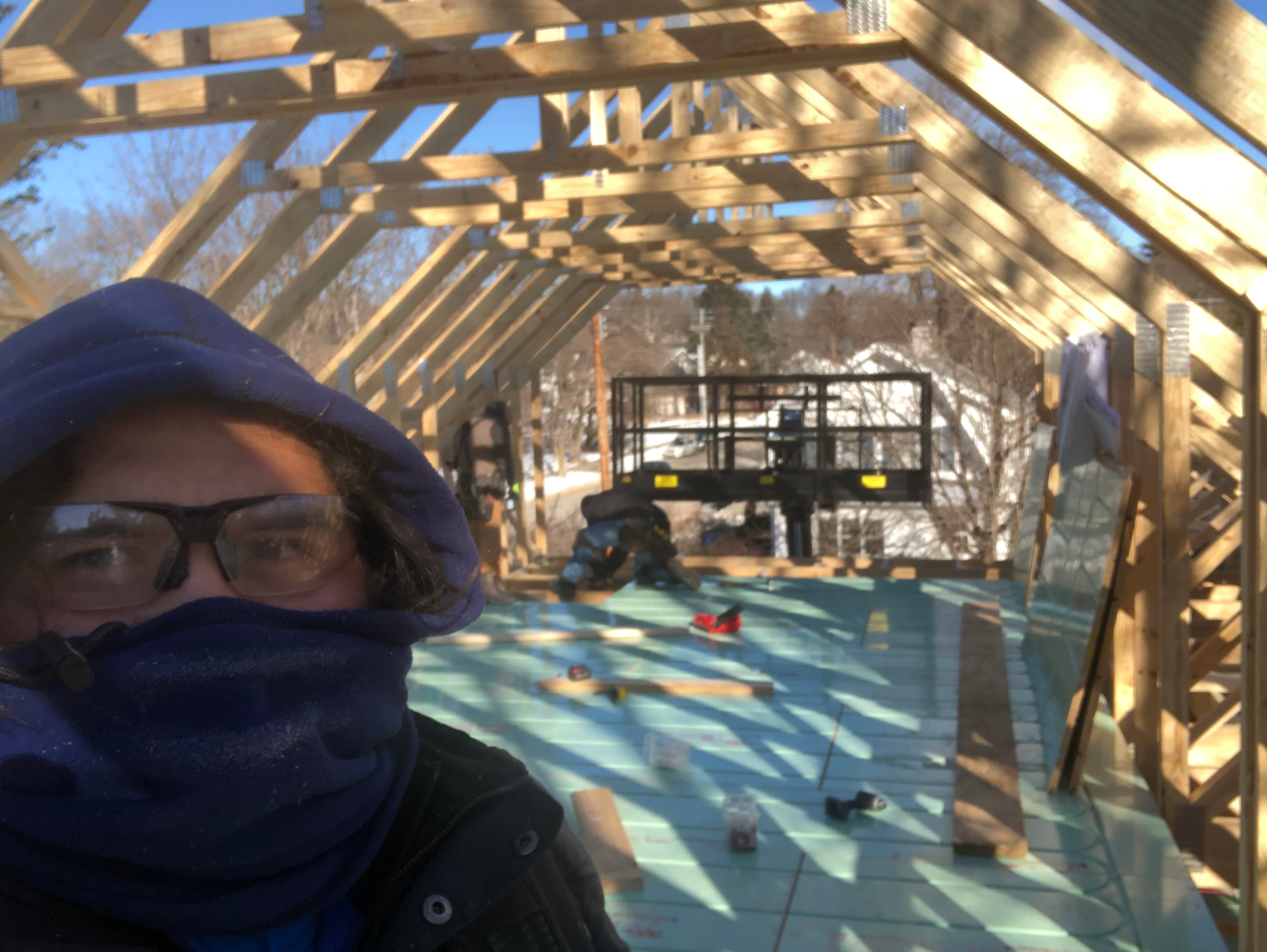 Victor Rojas working on an attic, Madison, winter ca 2020.